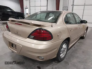 2003 Pontiac Grand Am SE1 with VIN 1G2NF52EX3C104710, listed as a IAAI auction lot 42053621 with 102,012 mi miles. Bid and sale history available at carsss.com. Image 4.