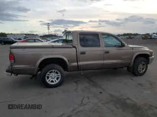 2001 Dodge Dakota z VIN 1B7GG2AX11S108005, wystawiony jako Copart lot #87124934 z przebiegiem 248 482 mil mil oraz Czysty tytuł • Clean title. Historia ofert i sprzedaży dostępna na DreamBid. Obrazek 3.