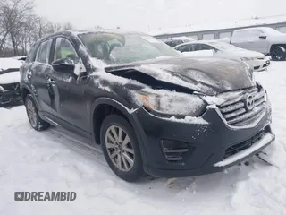 2016 Mazda CX-5 Sport z VIN JM3KE4BY0G0919017, wystawiony jako IAAI lot #41316161 z przebiegiem 209 259 mil mil oraz . Historia ofert i sprzedaży dostępna na DreamBid. Obrazek 1.
