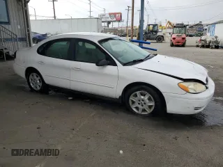 2006 Ford Taurus SE with VIN 1FAHP53U86A237001, listed as a Copart auction lot 62858785 with 133,697 mi miles and Salvage title. Bid and sale history available at DreamBid. Image 4.