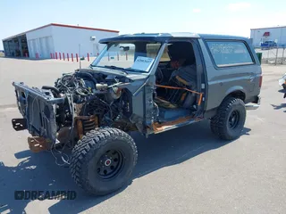 1988 Ford Bronco XL with VIN 1FMEU15N3JLA69197, listed as a IAAI auction lot 42082657 with 287,213 mi miles. Bid and sale history available at carsss.com. Image 2.