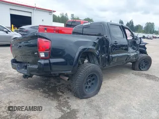 2018 Toyota Tacoma SR5 with VIN 3TMDZ5BN4JM047379, listed as a IAAI auction lot 39529466 with Not provided miles and . Bid and sale history available at DreamBid. Image 4.