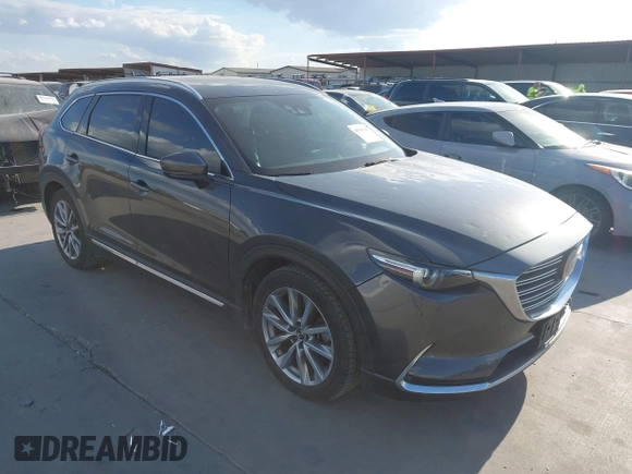 2016 Mazda CX-9 Grand Touring with VIN JM3TCADY8G0114940, listed as a IAAI auction lot 40701187 with 112,311 mi miles and . Bid and sale history available at DreamBid. Image 1.
