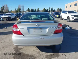 2002 Toyota Camry XLE z VIN 4T1BF30K82U506516, wystawiony jako IAAI lot #41278261 z przebiegiem 211 049 mil mil oraz . Historia ofert i sprzedaży dostępna na DreamBid. Obrazek 16.