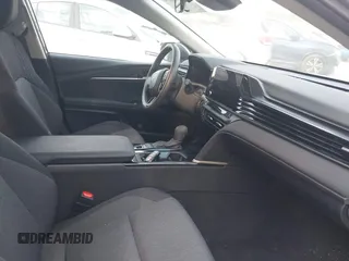 2025 Toyota Camry LE with VIN 4T1DAACKXSU541257, listed as a IAAI auction lot 42052246 with 13,585 mi miles and . Bid and sale history available at DreamBid. Image 5.
