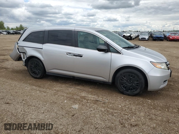 2014 Honda Odyssey LX z VIN 5FNRL5H21EB106600, wystawiony jako Copart lot #57875765 z przebiegiem 122 159 mil mil oraz Szkoda całkowita • Salvage title. Historia ofert i sprzedaży dostępna na DreamBid. Obrazek 4.