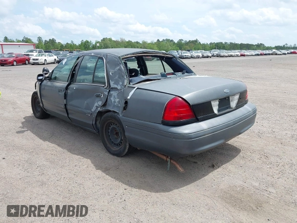 2001 Ford Crown Victoria Police Interceptor z VIN 2FAFP71W71X143506, wystawiony jako IAAI lot #41962780 z przebiegiem 254 040 mil mil oraz . Historia ofert i sprzedaży dostępna na DreamBid. Obrazek 3.
