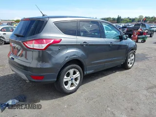 2015 Ford Escape SE with VIN 1FMCU0G75FUB31989, listed as a IAAI auction lot 42040121 with 87,068 mi miles and . Bid and sale history available at DreamBid. Image 4.