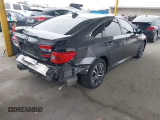 2020 Honda Accord with VIN 1HGCV3F10LA015906, listed as a IAAI auction lot 41895296 with 106,341 mi miles and . Bid and sale history available at DreamBid. Image 4.