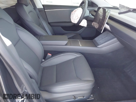 2025 Tesla Model 3 Long Range with VIN 5YJ3E1EA5SF978214, listed as a IAAI auction lot 42525444 with 6,489 mi miles and . Bid and sale history available at DreamBid. Image 5.