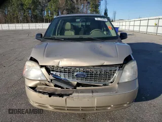 2007 Ford Freestar SEL z VIN 2FMDA52217BA11300, wystawiony jako Copart lot #48144555 z przebiegiem 184 225 mil mil oraz Szkody całkowita. Historia ofert i sprzedaży dostępna na DreamBid. Obrazek 5.