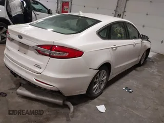 2019 Ford Fusion Hybrid SEL with VIN 3FA6P0MU8KR272811, listed as a IAAI auction lot 41705282 with 56,565 mi miles. Bid and sale history available at carsss.com. Image 4.