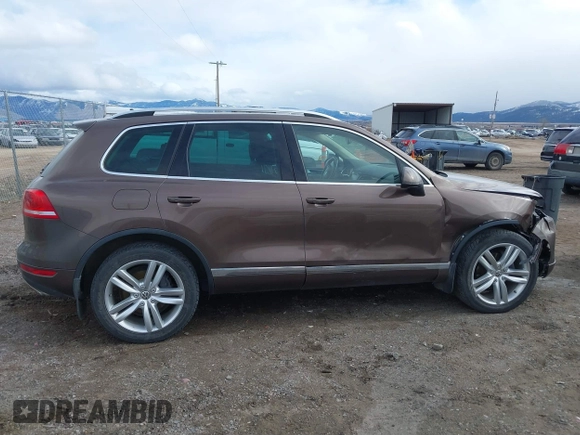 2013 Volkswagen Touareg Lux with VIN WVGEF9BP1DD012851, listed as a IAAI auction lot 41732391 with 123,283 mi miles and . Bid and sale history available at DreamBid. Image 14.