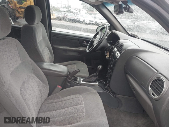 2003 GMC Envoy SLT z VIN 1GKET16S936221162, wystawiony jako IAAI lot #42366344 z przebiegiem 168 273 mil mil oraz . Historia ofert i sprzedaży dostępna na DreamBid. Obrazek 5.