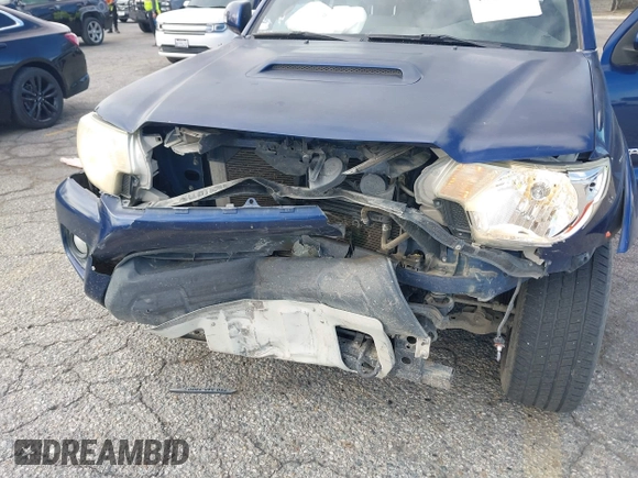 2015 Toyota Tacoma with VIN 3TMMU4FN0FM077148, listed as a IAAI auction lot 41274934 with 112,617 mi miles and . Bid and sale history available at DreamBid. Image 6.