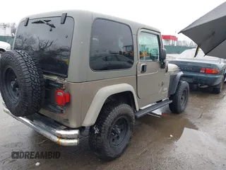 2006 Jeep Wrangler Sport Right Hand Drive with VIN 1J4F449S06P725862, listed as a IAAI auction lot 41562989 with 121,997 mi miles. Bid and sale history available at carsss.com. Image 4.