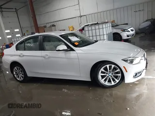 2018 BMW 3 Series 320i xDrive with VIN WBA8E5G56JNU47338, listed as a IAAI auction lot 41238204 with 54,596 mi miles. Bid and sale history available at carsss.com. Image 13.