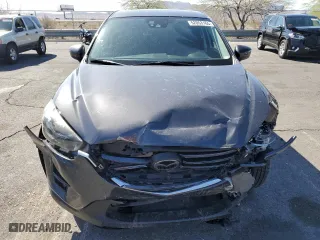 2016 Mazda CX-5 Grand Touring with VIN JM3KE4DY0G0674717, listed as a Copart auction lot 52053165 with 36,341 mi miles and Salvage Title. Bid and sale history available at carsss.com. Image 5.
