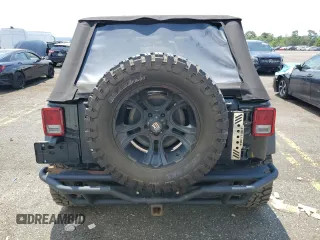 2015 Jeep Wrangler Unlimited Sport with VIN 1C4BJWDG1FL668395, listed as a Copart auction lot 64035035 with 79,972 mi miles and Salvage title. Bid and sale history available at DreamBid. Image 6.