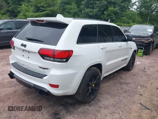 2021 Jeep Grand Cherokee Trackhawk with VIN 1C4RJFN95MC843131, listed as a IAAI auction lot 42688185 with 16,391 mi miles and . Bid and sale history available at DreamBid. Image 4.