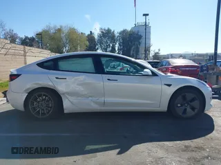 2023 Tesla Model 3 with VIN 5YJ3E1EA6PF411940, listed as a IAAI auction lot 41829537 with 32,877 mi miles and . Bid and sale history available at carsss.com. Image 12.