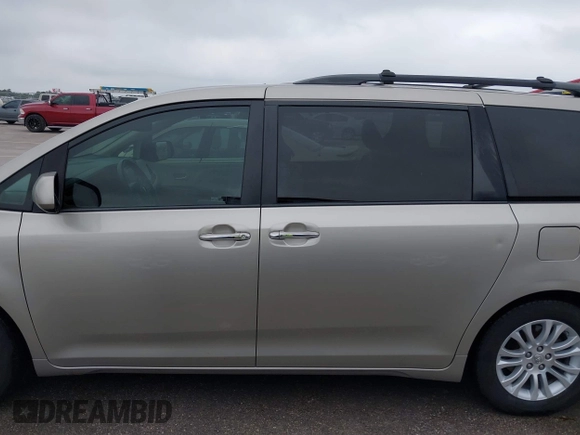 2015 Toyota Sienna XLE with VIN 5TDYK3DCXFS578888, listed as a IAAI auction lot 42187384 with 105,287 mi miles and . Bid and sale history available at DreamBid. Image 14.
