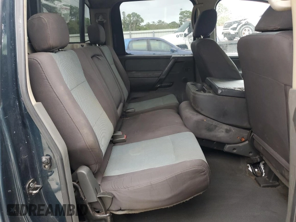 2006 Nissan Titan LE z VIN 1N6BA07B16N557411, wystawiony jako Copart lot #86058634 z przebiegiem 263 198 mil mil oraz Szkody całkowita. Historia ofert i sprzedaży dostępna na DreamBid. Obrazek 10.