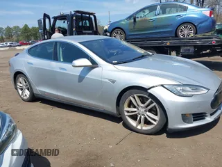 2015 Tesla Model S 85D with VIN 5YJSA1H2XFF084145, listed as a IAAI auction lot 42101755 with 105,660 mi miles. Bid and sale history available at carsss.com. Image 13.