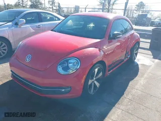2012 Volkswagen Beetle 2.0T Turbo w/Sun/Sound with VIN 3VWV67ATXCM650376, listed as a IAAI auction lot 41315431 with 104,523 mi miles. Bid and sale history available at carsss.com. Image 17.