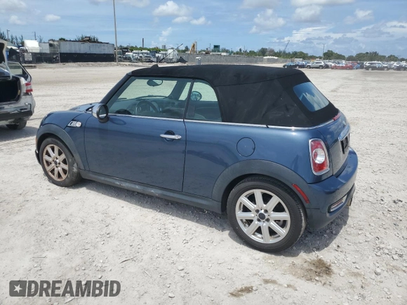 2011 MINI Convertible S with VIN WMWZP3C50BTX83220, listed as a Copart auction lot 61590205 with 80,979 mi miles and Salvage title. Bid and sale history available at DreamBid. Image 2.