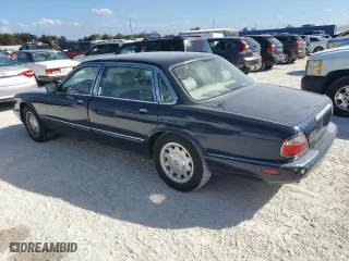 1999 Jaguar XJ with VIN SAJKX6049XC853940, listed as a Copart auction lot 74581244 with 0 mi miles and Salvage Title. Bid and sale history available at carsss.com. Image 2.