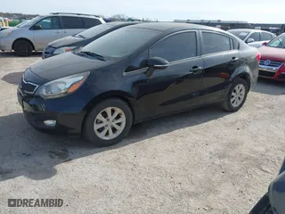 2013 Kia Rio EX with VIN KNADN4A39D6096262, listed as a IAAI auction lot 41094665 with 120,919 mi miles. Bid and sale history available at carsss.com. Image 2.