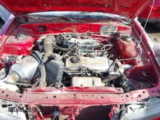 1990 Mitsubishi Mirage z VIN JA3CU26X2LU049259, wystawiony jako IAAI lot #41788912 z przebiegiem Nie podano mil oraz . Historia ofert i sprzedaży dostępna na DreamBid. Obrazek 10.