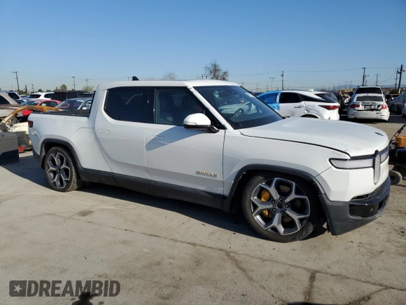 2022 Rivian R1T Adventure z VIN 7FCTGAAA9NN014280, wystawiony jako Copart lot #49723355 z przebiegiem 28 601 mil mil oraz Szkody całkowita. Historia ofert i sprzedaży dostępna na DreamBid. Obrazek 4.