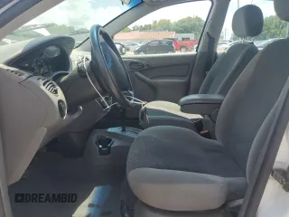 2003 Ford Focus SE with VIN 1FAFP34353W231334, listed as a Copart auction lot 63844205 with 86,601 mi miles and Salvage title. Bid and sale history available at DreamBid. Image 7.
