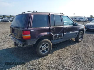 1996 Jeep Grand Cherokee Laredo with VIN 1J4GZ58S2TC262980, listed as a IAAI auction lot 41949514 with 269,674 mi miles and . Bid and sale history available at DreamBid. Image 4.