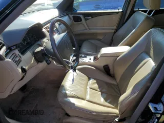 1997 Mercedes-Benz E-Class with VIN WDBJF55F4VJ034892, listed as a Copart auction lot 89406595 with 118,494 mi miles and Salvage Title. Bid and sale history available at carsss.com. Image 7.