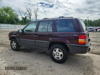 1994 Jeep Grand Cherokee Laredo z VIN 1J4GZ58S0RC221854, wystawiony jako Copart lot #61950825 z przebiegiem 69 465 mil mil oraz Czysty tytuł • Clean title. Historia ofert i sprzedaży dostępna na DreamBid. Obrazek 2.