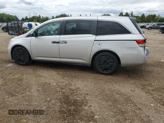 2014 Honda Odyssey LX z VIN 5FNRL5H21EB106600, wystawiony jako Copart lot #57875765 z przebiegiem 122 159 mil mil oraz Szkoda całkowita • Salvage title. Historia ofert i sprzedaży dostępna na DreamBid. Obrazek 2.