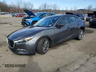 2018 Mazda 3 Grand Touring z VIN 3MZBN1W31JM214203, wystawiony jako Copart lot #50160795 z przebiegiem 51 682 mil mil oraz Szkoda całkowita • Salvage title. Historia ofert i sprzedaży dostępna na DreamBid. Obrazek 1.