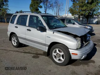 2002 Suzuki Vitara JLS z VIN 2S3TE52V126109079, wystawiony jako Copart lot #41477725 z przebiegiem 147 255 mil mil oraz Szkody całkowita. Historia ofert i sprzedaży dostępna na DreamBid. Obrazek 4.