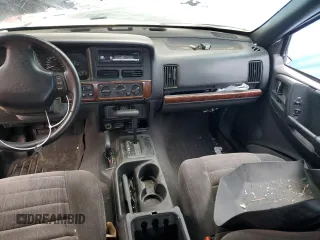 1997 Jeep Grand Cherokee Laredo with VIN 1J4GZ58Y0VC547880, listed as a Copart auction lot 79866684 with 0 mi miles and Salvage Title. Bid and sale history available at carsss.com. Image 8.