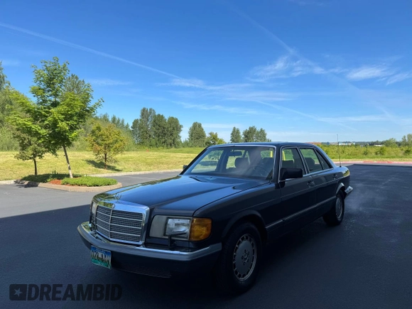 1986 Mercedes-Benz 560 with VIN WDBCA39D0GA203068, listed as a Copart auction lot 56704555 with 107,817 mi miles and Clean Title. Bid and sale history available at DreamBid. Image 2.