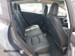 2023 Tesla Model 3 with VIN 5YJ3E1EA5PF565071, listed as a IAAI auction lot 42232719 with 15,389 mi miles and . Bid and sale history available at DreamBid. Image 8.