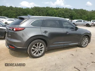2017 Mazda CX-9 Grand Touring z VIN JM3TCADYXH0138805, wystawiony jako Copart lot #59201915 z przebiegiem 147 896 mil mil oraz Czysty tytuł • Clean title. Historia ofert i sprzedaży dostępna na DreamBid. Obrazek 3.