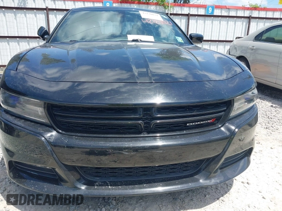 2015 Dodge Charger SXT with VIN 2C3CDXHG2FH852208, listed as a IAAI auction lot 42120021 with 156,486 mi miles and . Bid and sale history available at DreamBid. Image 6.