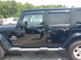 2014 Jeep Wrangler Unlimited Sahara with VIN 1C4BJWEG0EL273086, listed as a IAAI auction lot 42340938 with 121,448 mi miles and . Bid and sale history available at DreamBid. Image 14.