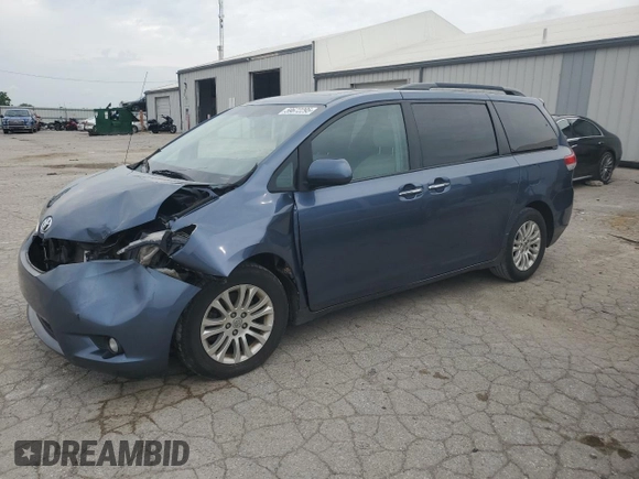 2014 Toyota Sienna XLE with VIN 5TDYK3DC2ES520840, listed as a Copart auction lot 59672295 with 194,143 mi miles and Salvage title. Bid and sale history available at DreamBid. Image 1.