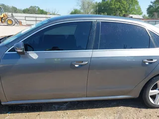 2015 Volkswagen Passat 1.8T Wolfsburg Ed with VIN 1VWAT7A3XFC115934, listed as a IAAI auction lot 41948035 with 243,143 mi miles. Bid and sale history available at carsss.com. Image 15.