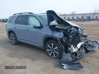 2023 Honda Pilot Elite z VIN 5FNYG1H8XPB042394, wystawiony jako IAAI lot #42067185 z przebiegiem 27 974 mil mil oraz . Historia ofert i sprzedaży dostępna na DreamBid. Obrazek 1.